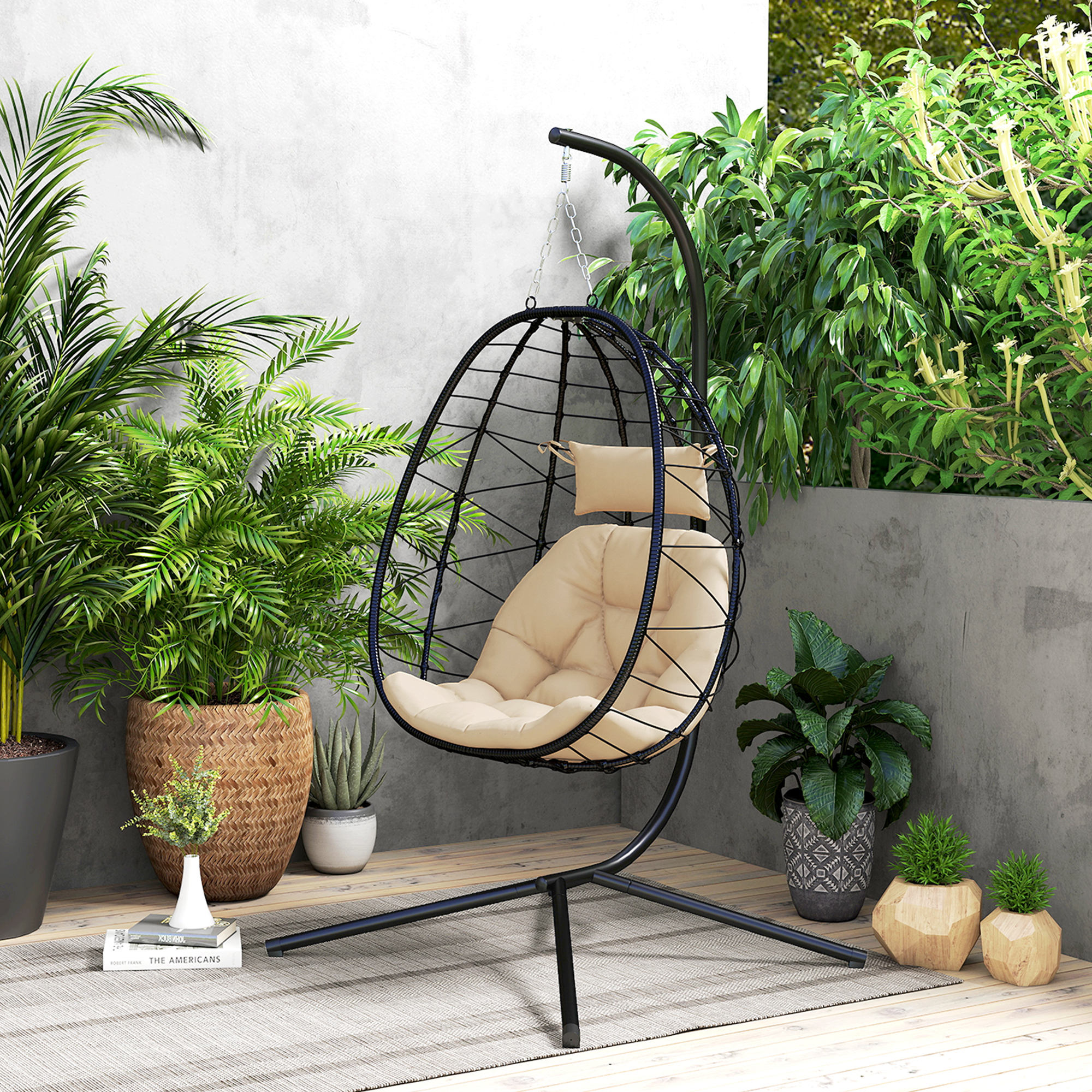 Egg chair with stand shown on balcony with foldable basket detail
