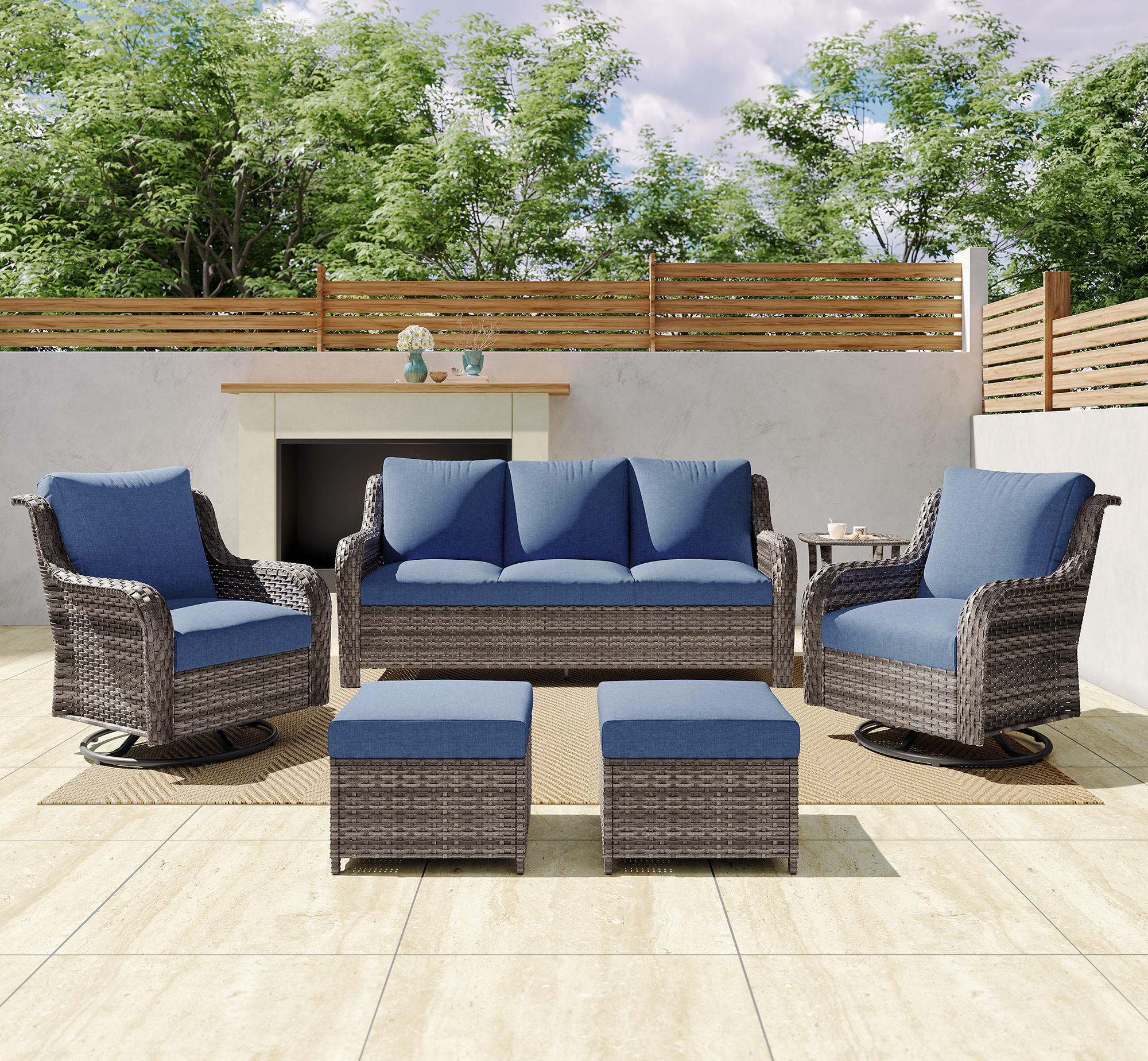 JB A Three-seater Sofa    Two Swivel Chairs    Two Footstools    A Side Table