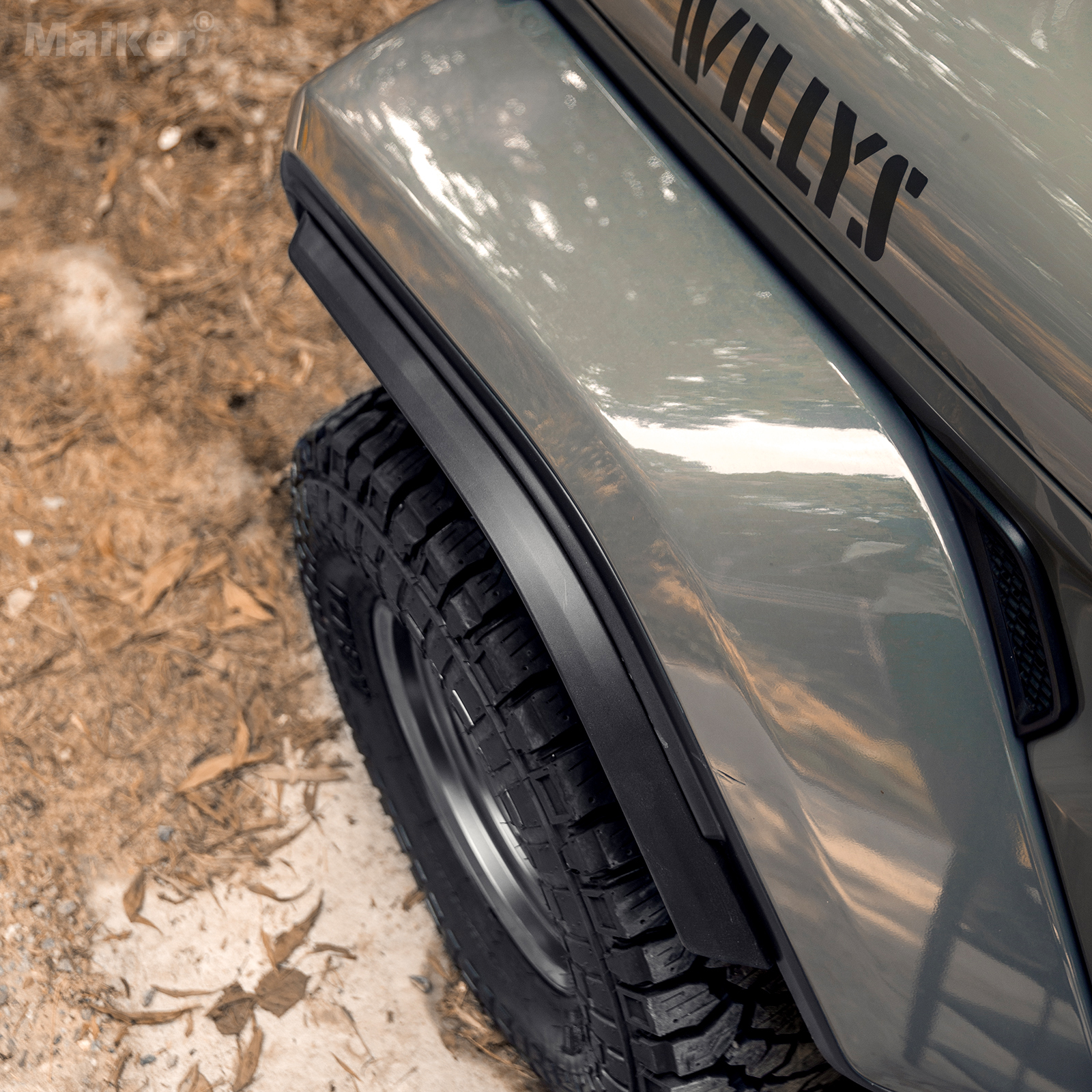 Front driver-side bolt-on fender flare installed on Jeep Wrangler JL Sahara matte black finish