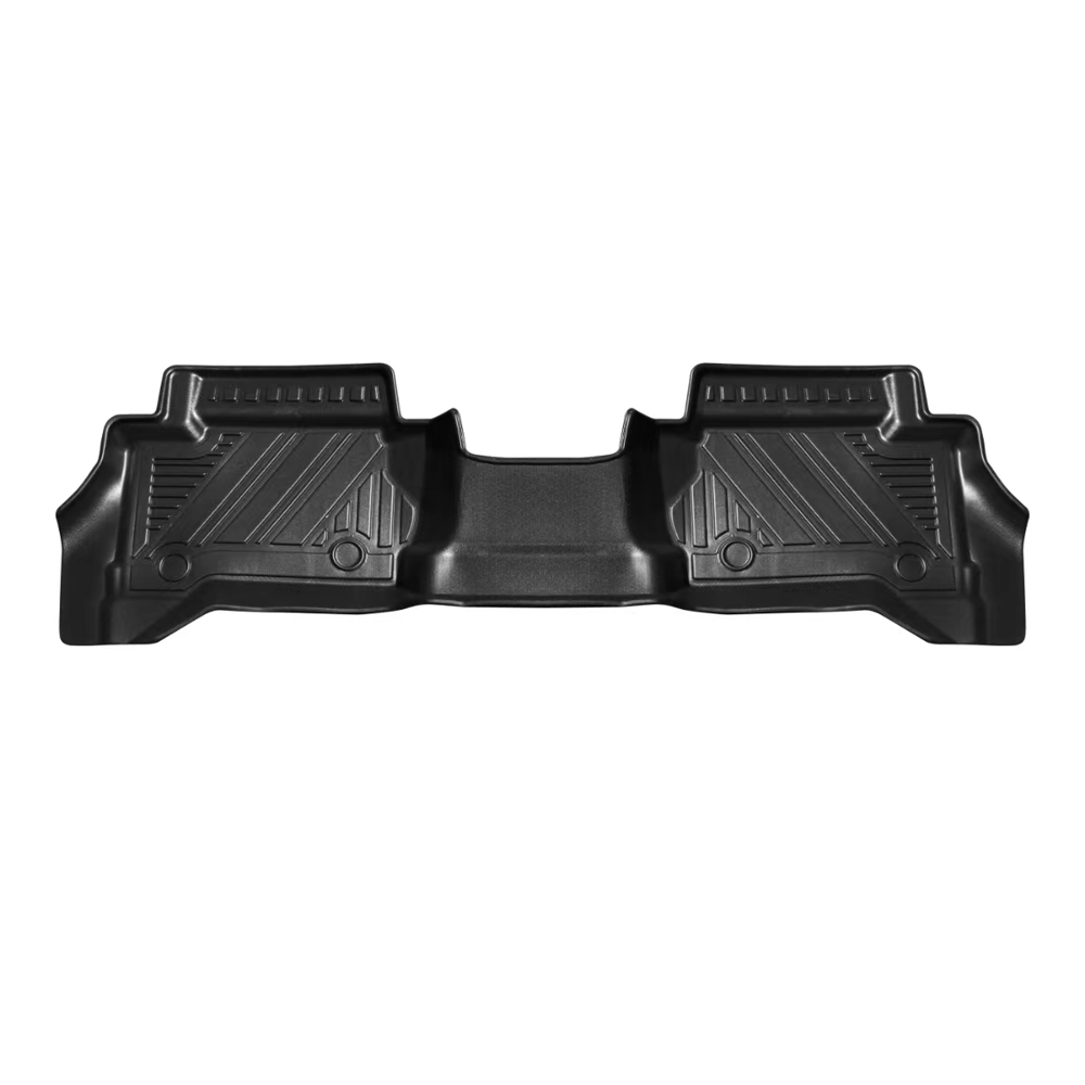CYDD 2024 Tacoma all-weather floor liner being rinsed clean showing easy-wash TPE surface