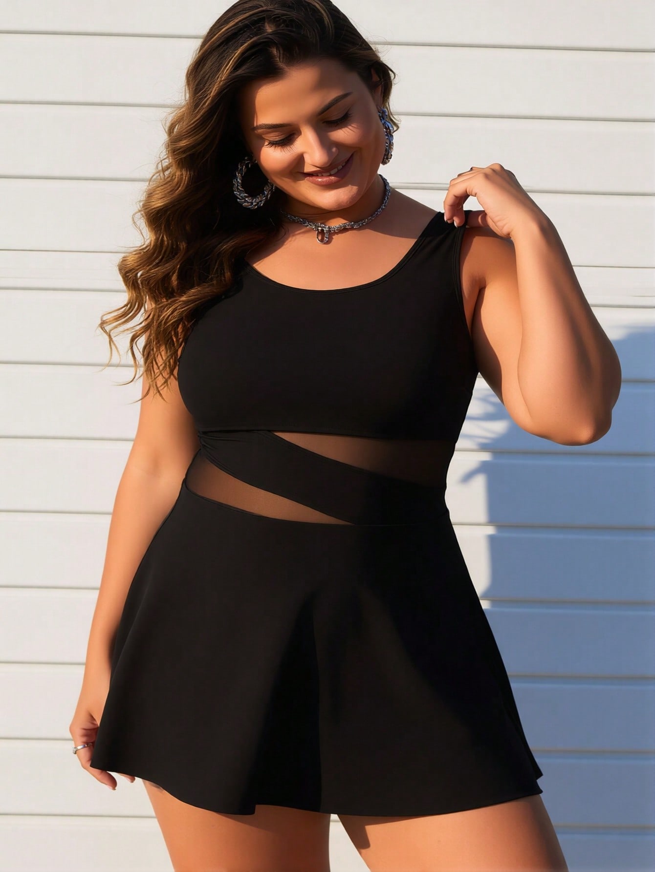 Women's plus size black swimdress styled for beach vacation — full outfit