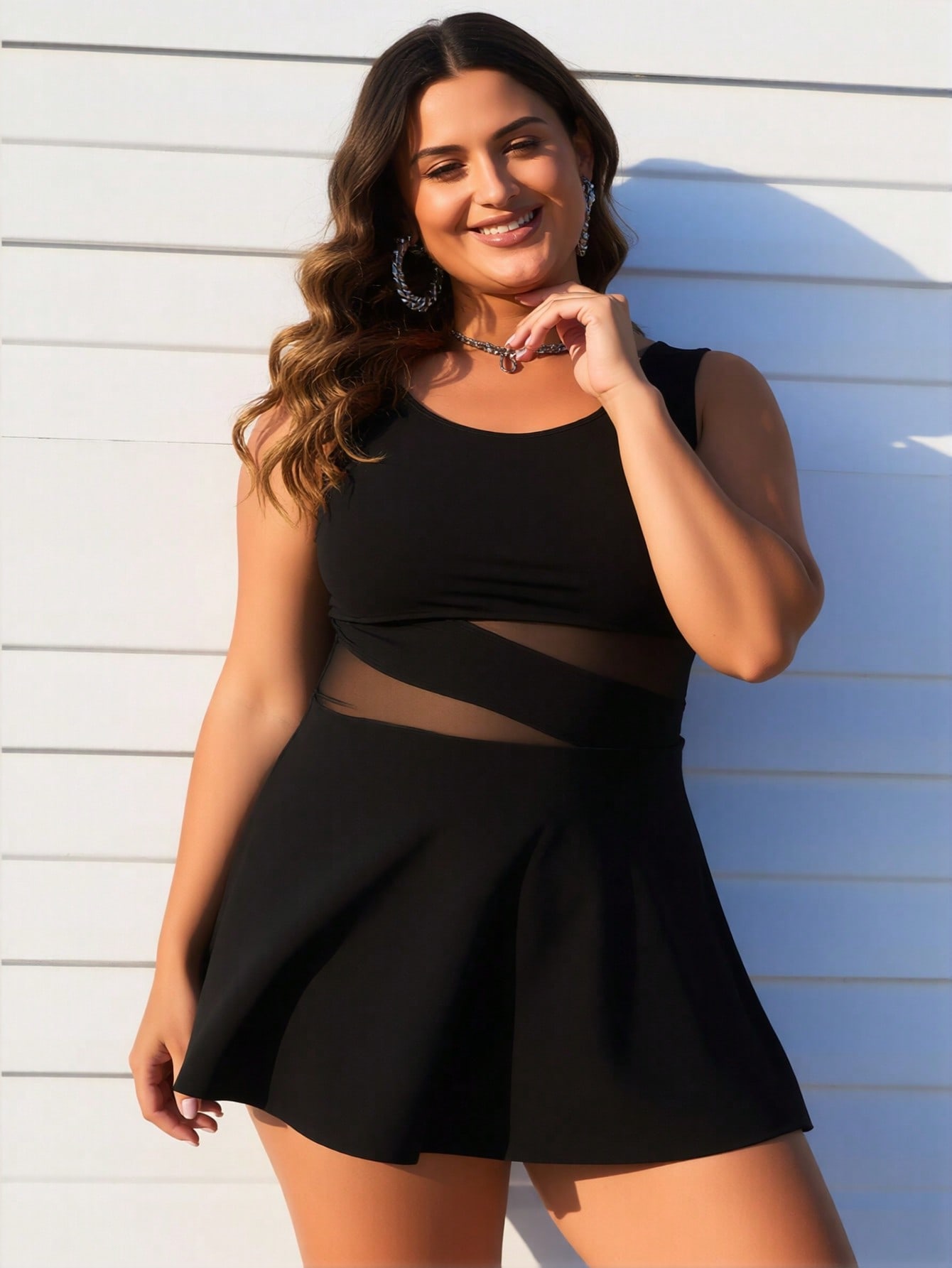 Women's plus size black swimdress — vacation styling editorial