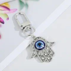 Blue Eye Key Ring Bag Pendant - Silver Hollow Flower Hand - View 1