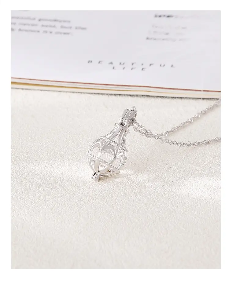 Fashion Creative Inlaid Pearl Round Bead Cage Pendant
