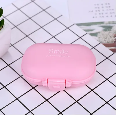 Macarons small pill box Japanese plastic pill box portable portable mini sub four compartment storage box pill box Pink - Shop at LoveMi