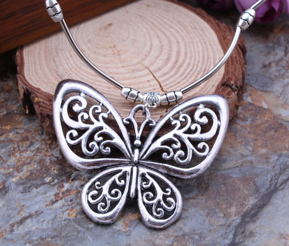 Carved openwork butterfly pendant