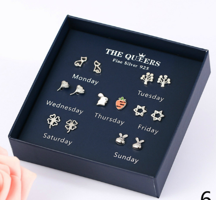 One week asymmetrical earrings boxed