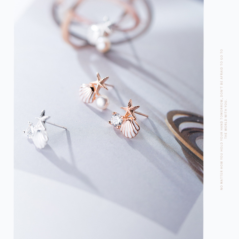 A starfish shell studded with diamond earrings