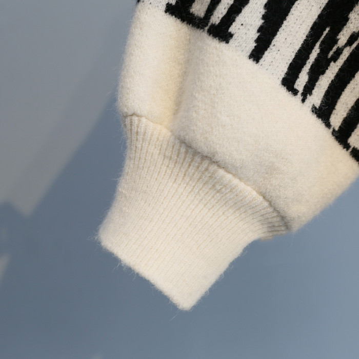 Turtleneck sweater letter holes