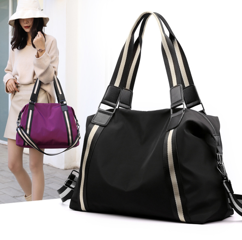 حقيبة سفر نسائية قماشية مخططة قابلة للطي بتصميم كوري