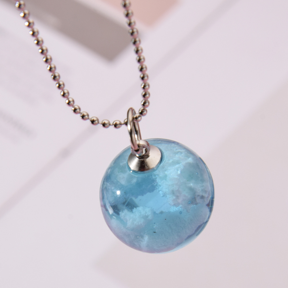 Blue sky and white clouds transparent spherical resin earrings