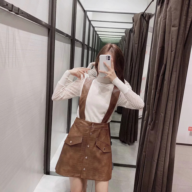 Faux leather mini skirt with strap