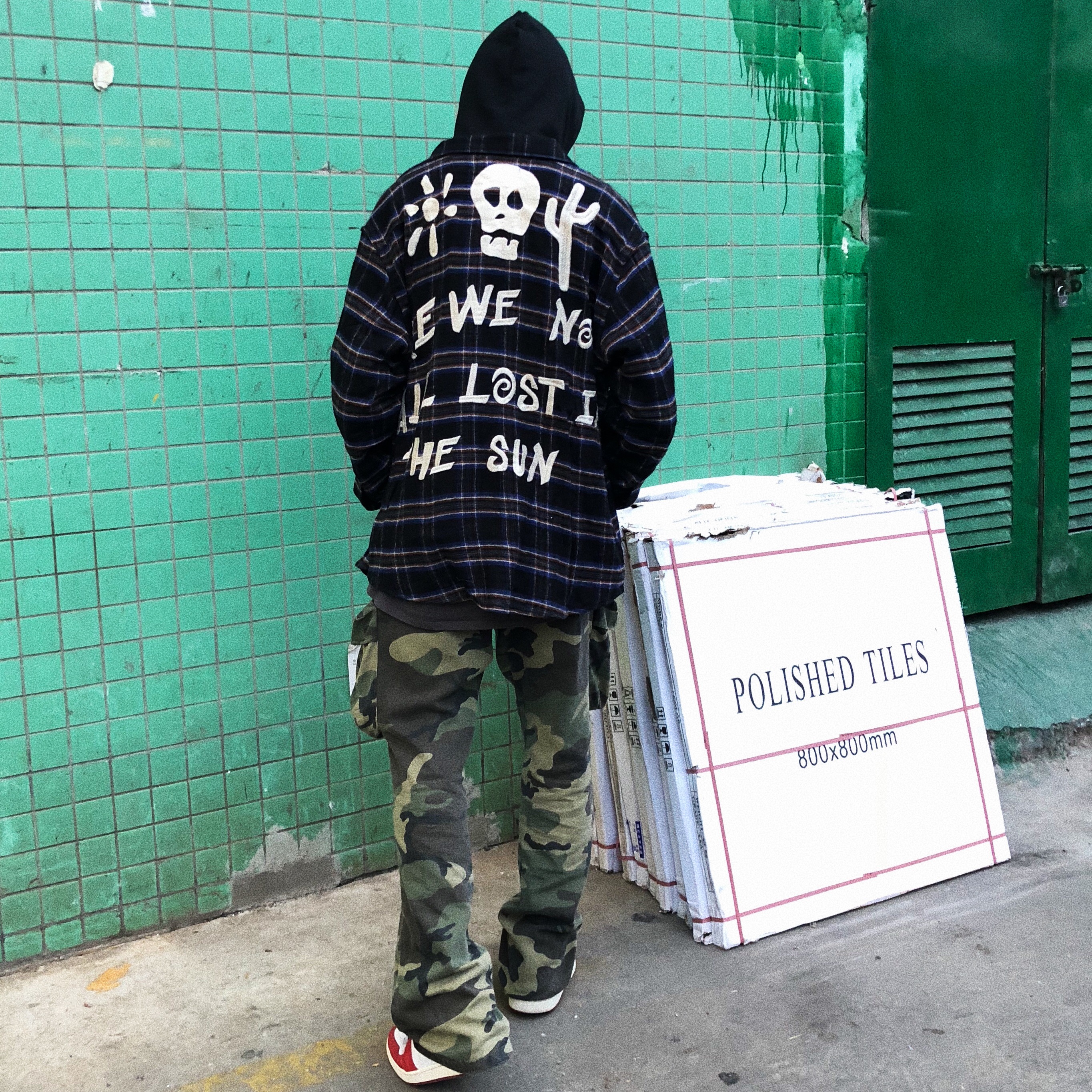 Distressed camouflage overalls