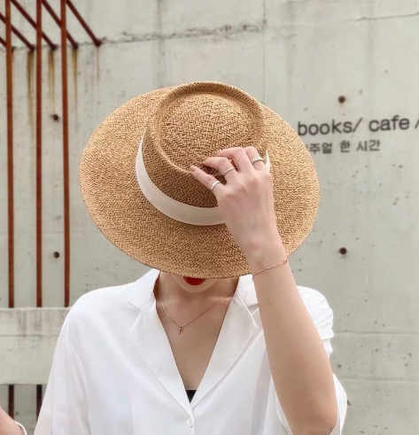The same flat-top wide-brimmed straw hat