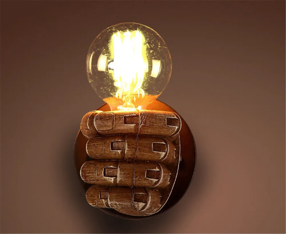 Fist resin wall lamp creates decorative