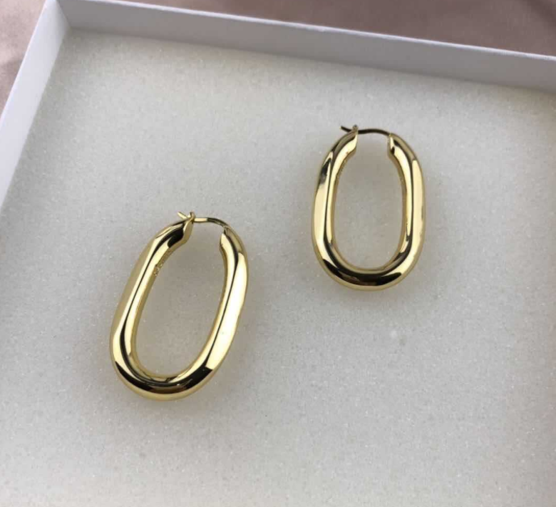 Exaggerated gold U-shaped earrings