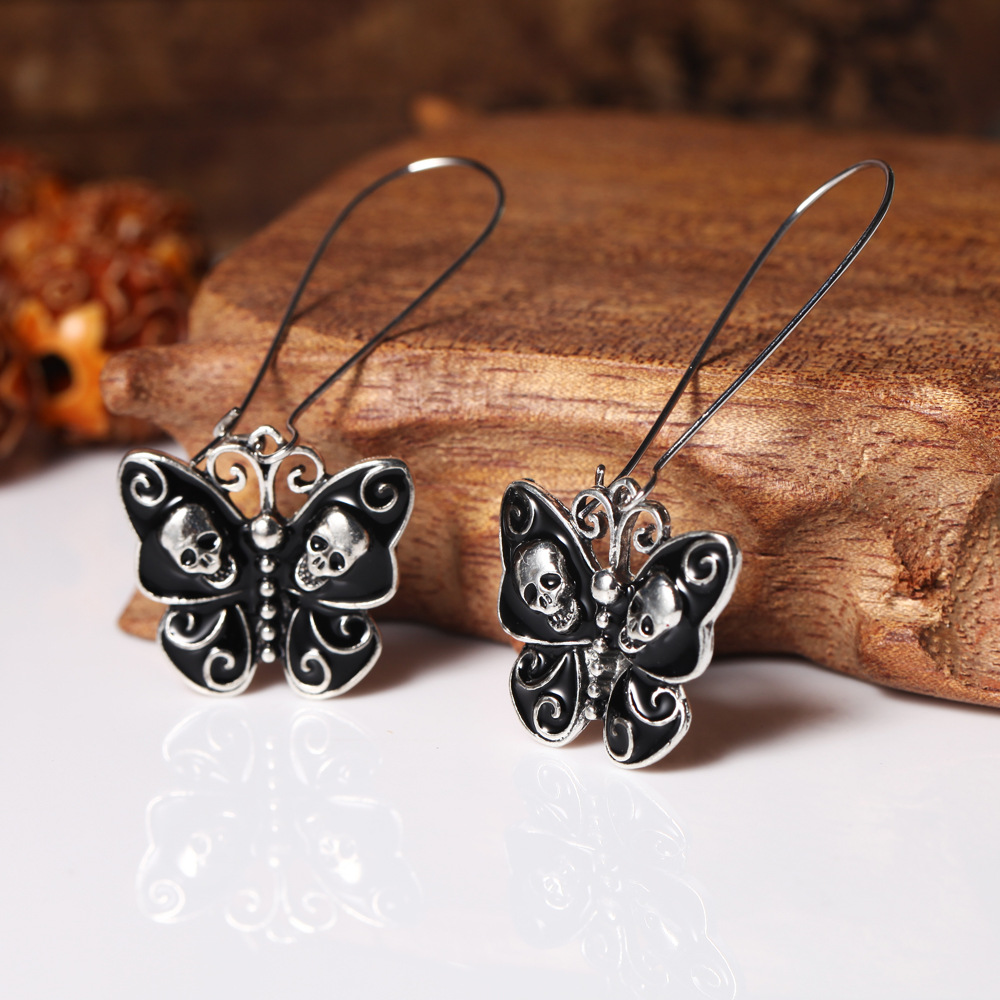 Butterfly skull earrings