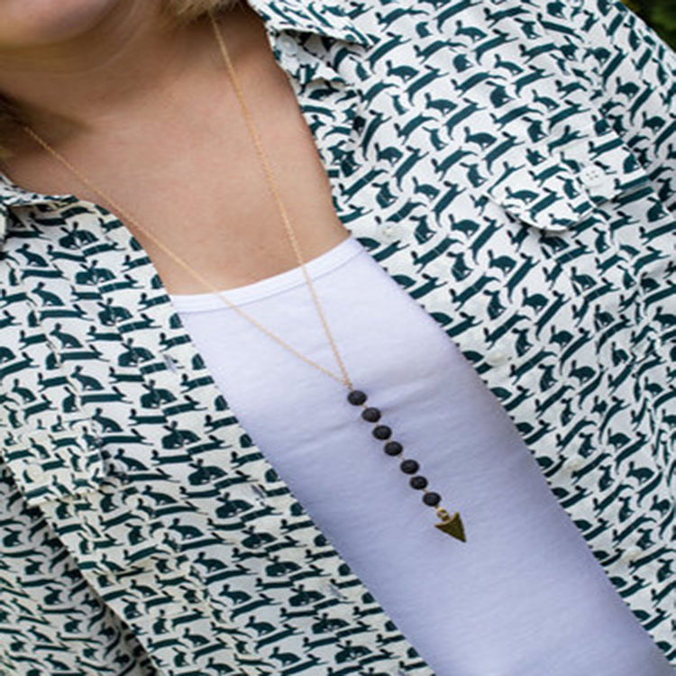 Volcanic stone arrow sweater necklace