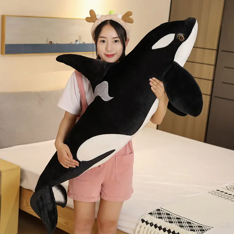 Whale orca holding pillow