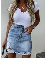 Irregular bag hip tassel ripped denim skirt