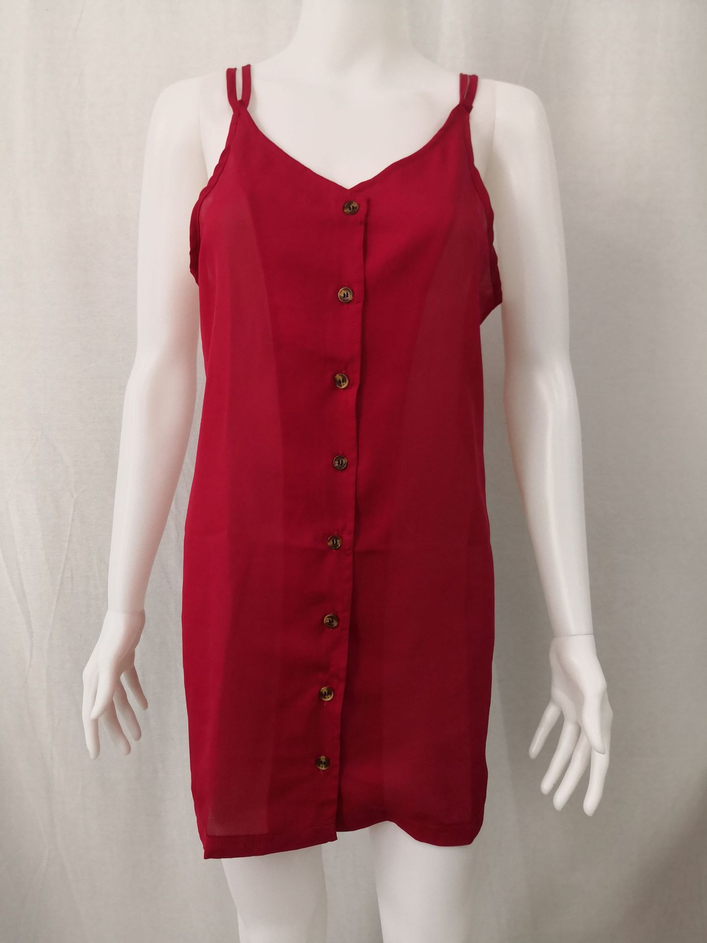 Women's dress with suspender collar and button