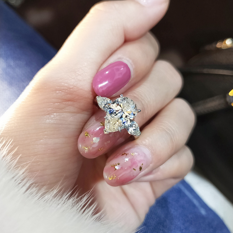 Engagement drop pear-shaped ring