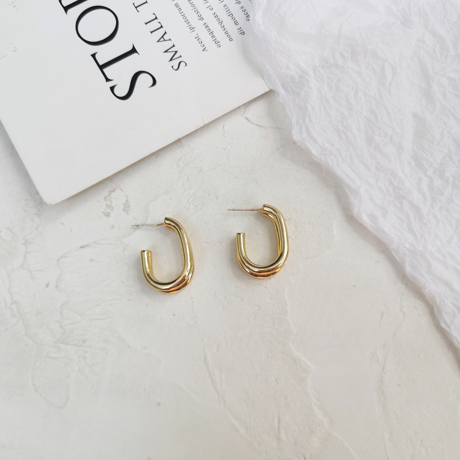 Female Curved Silver Stud Earrings