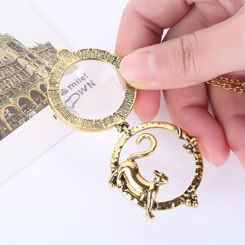 Vintage cat magnifying glass necklace