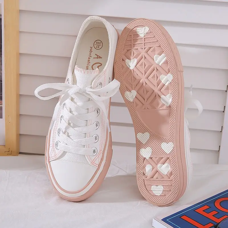 Small dirty orange canvas shoes