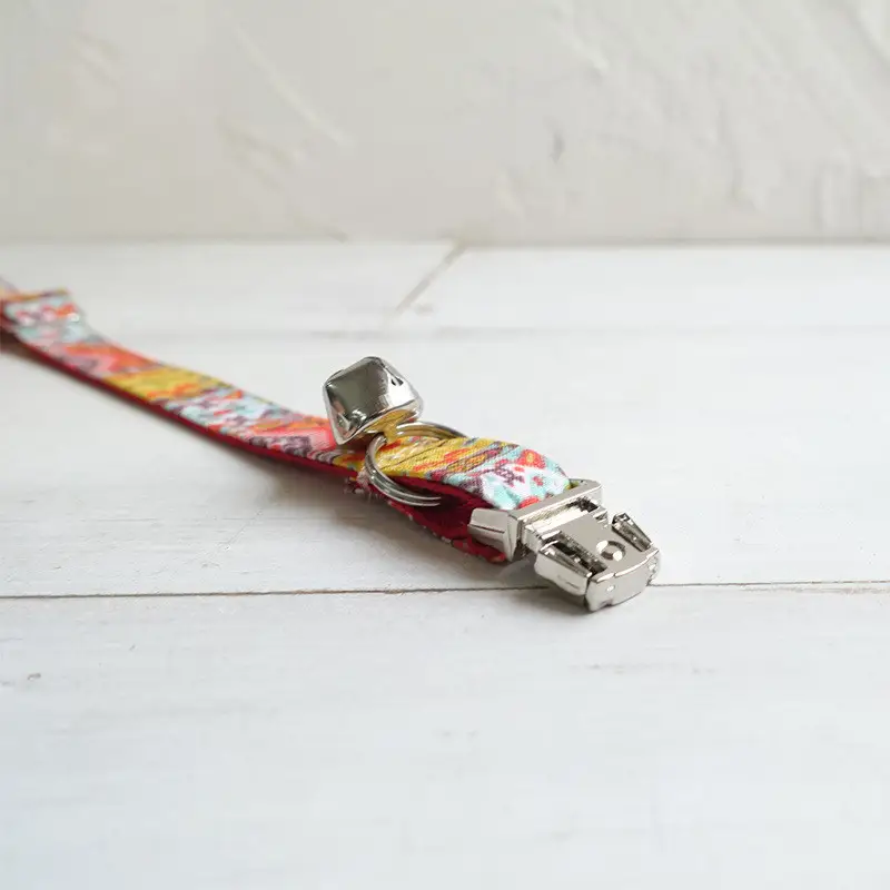 Adjustable pet collar with bell
