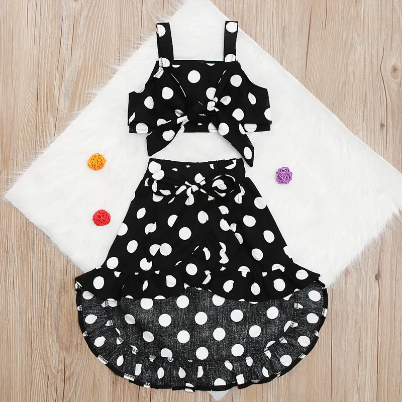 Polka dot top + irregular short skirt two-piece suit