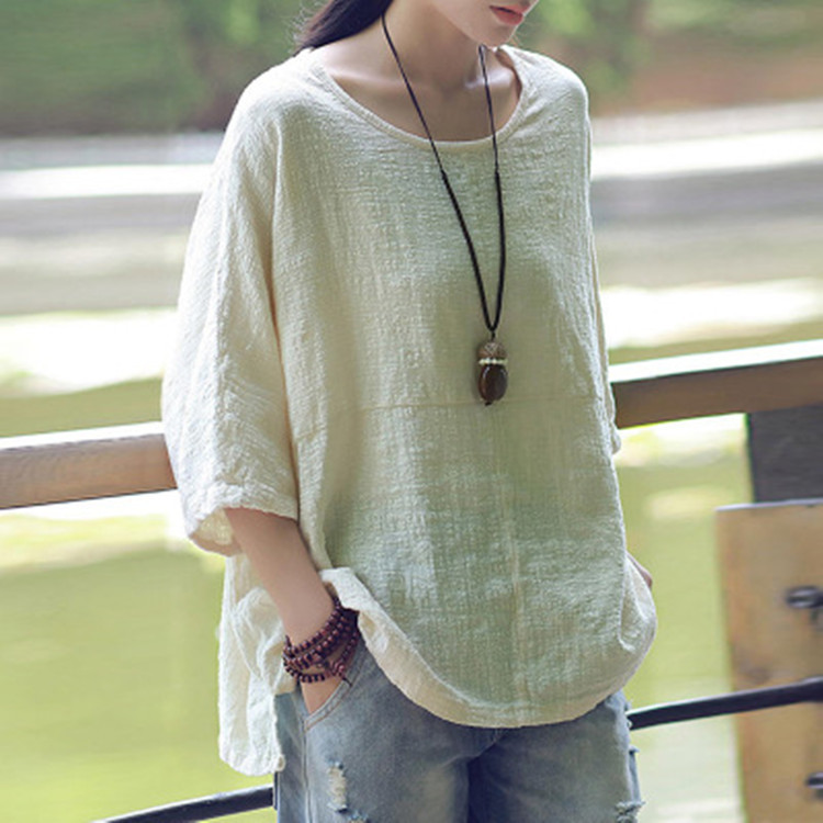 Women's bat sleeve solid top