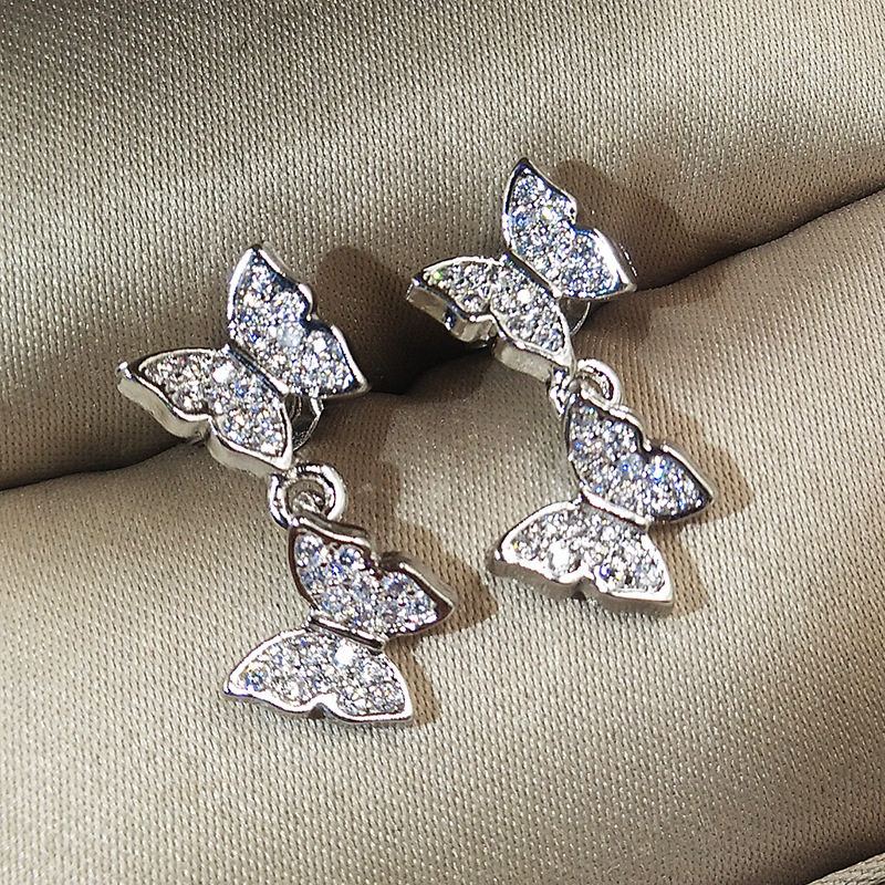 Bow-set diamond earrings