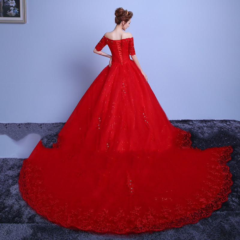 Red trailing one-shoulder wedding dress