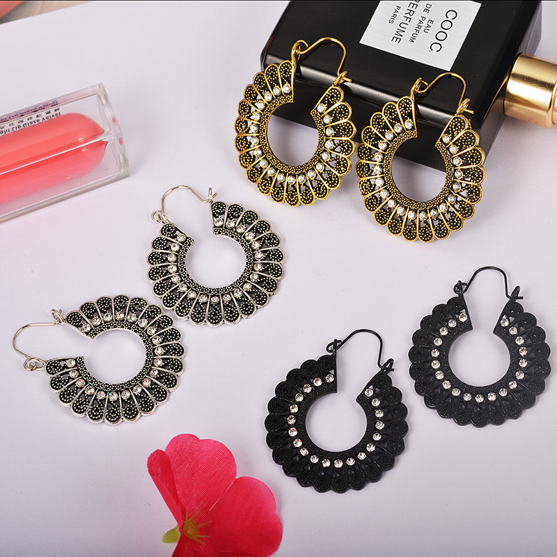 Retro hollow carved pattern earrings
