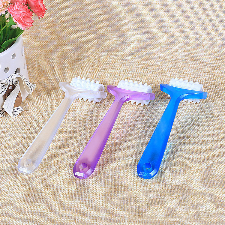 Small plastic roller face massager