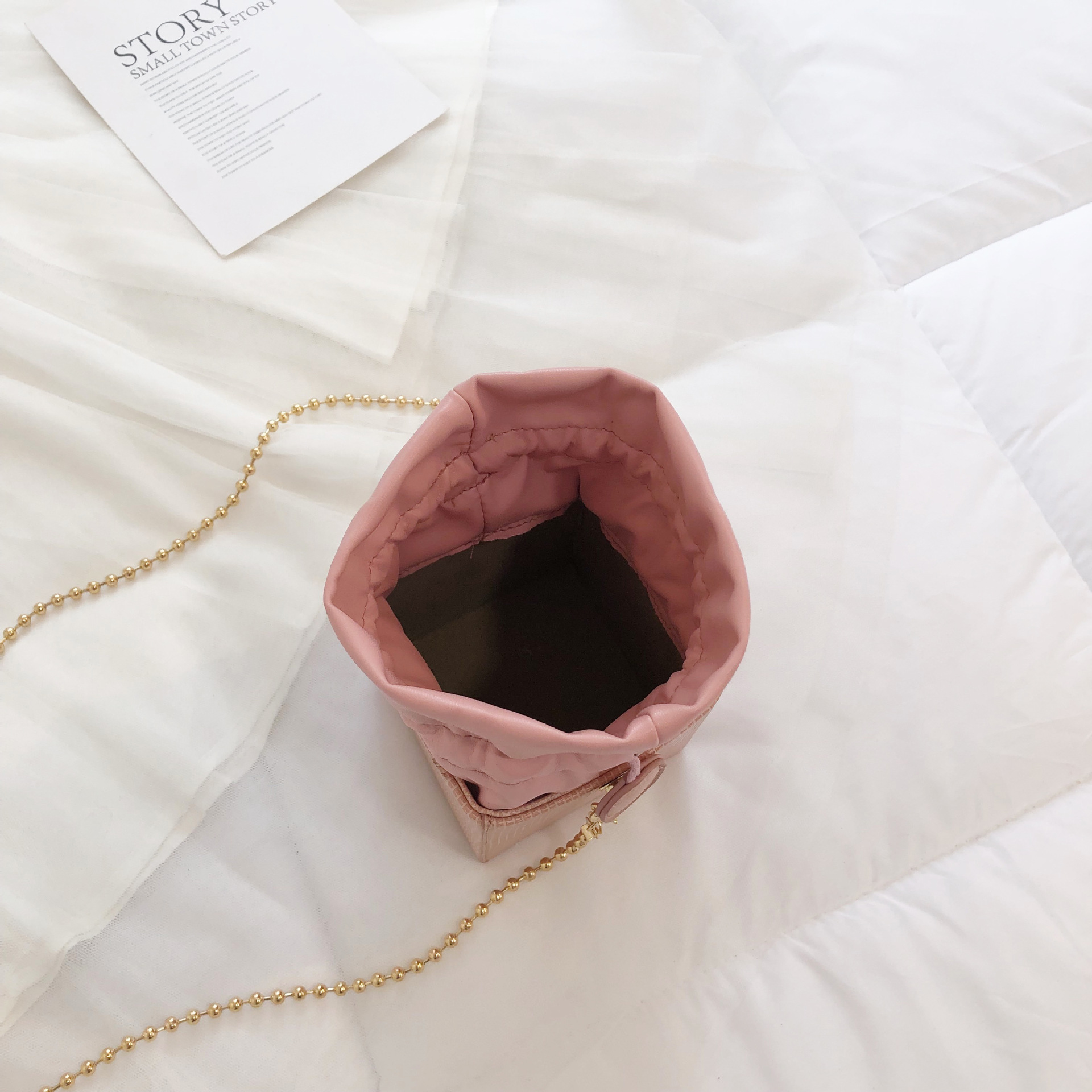 Chain drawstring crossbody bag