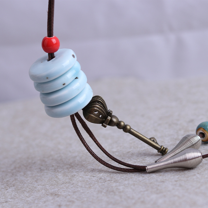Feather geometric ceramic sweater chain