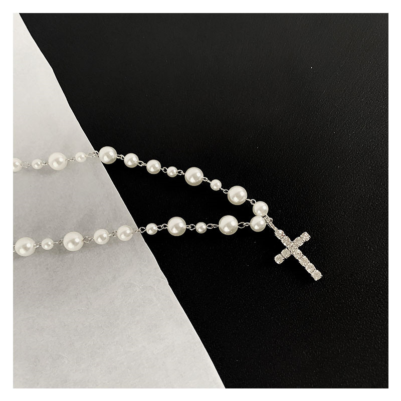 Diamond cross pendant pearl necklace
