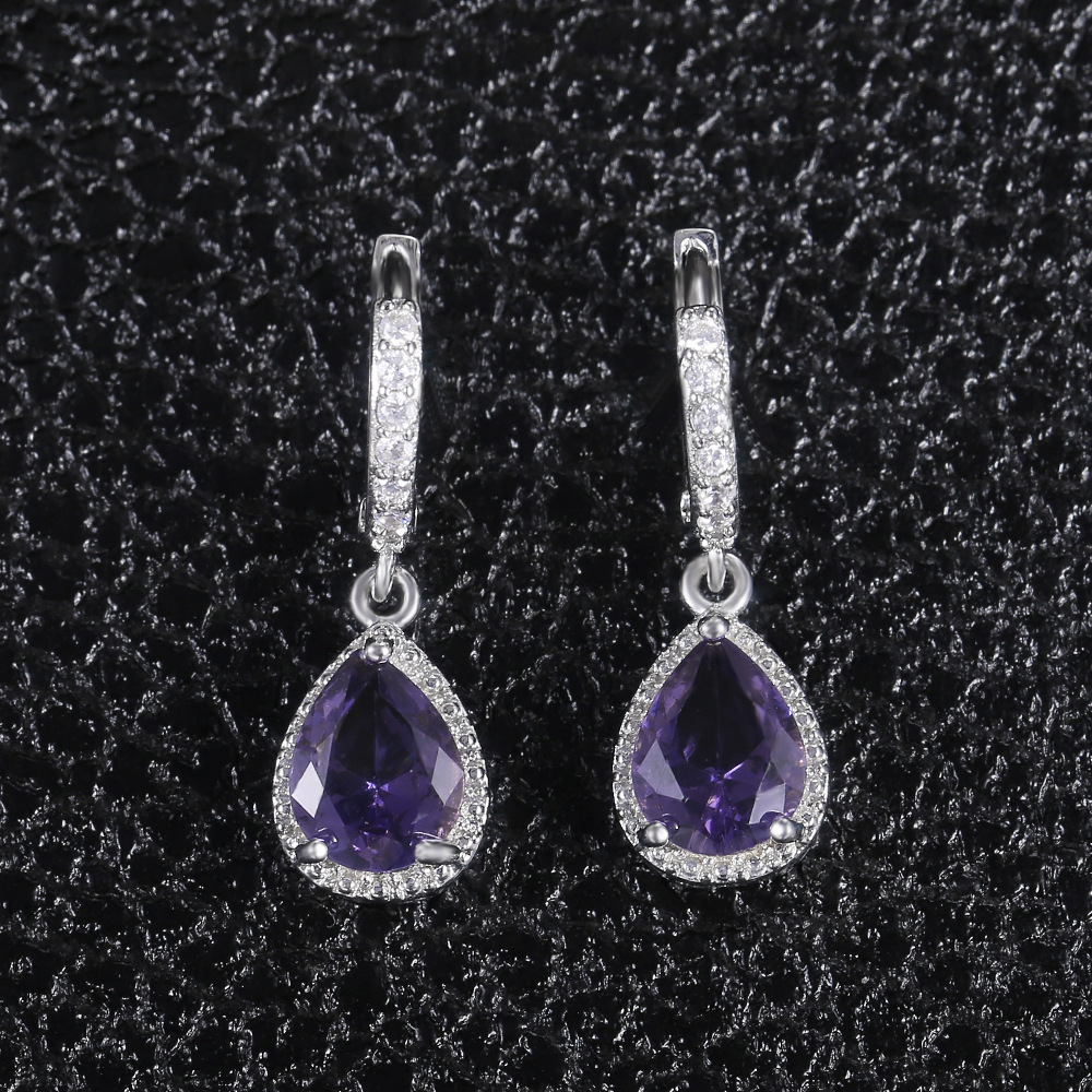 Prong set purple gemstone earrings