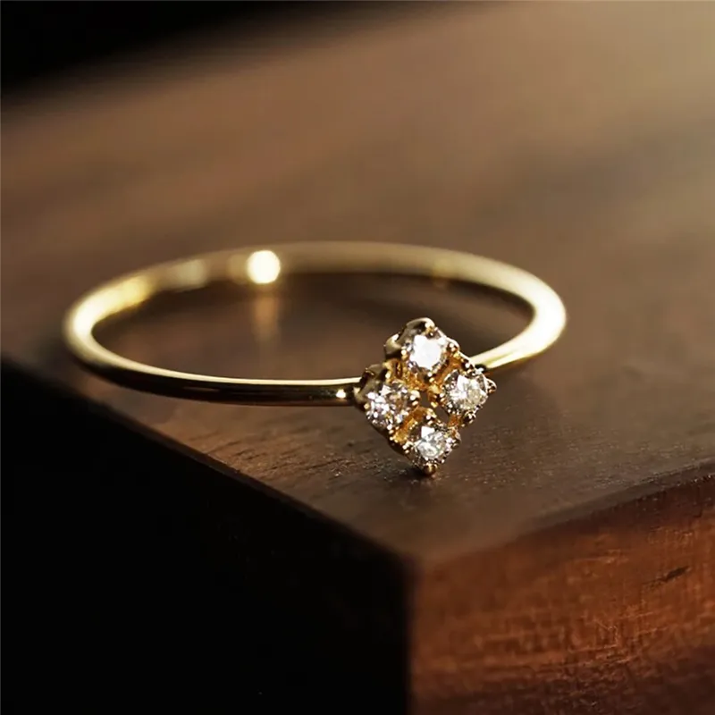 Four heart rings in the night sky - Gold
