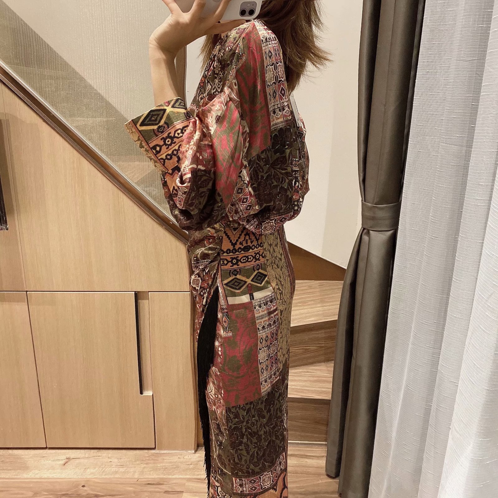 V-neck dress with fringe decoration