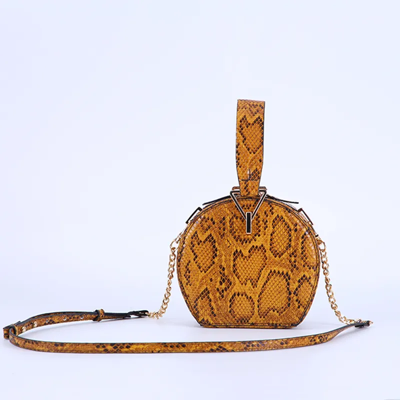 One-shoulder diagonal snake print small round bag - Ginger