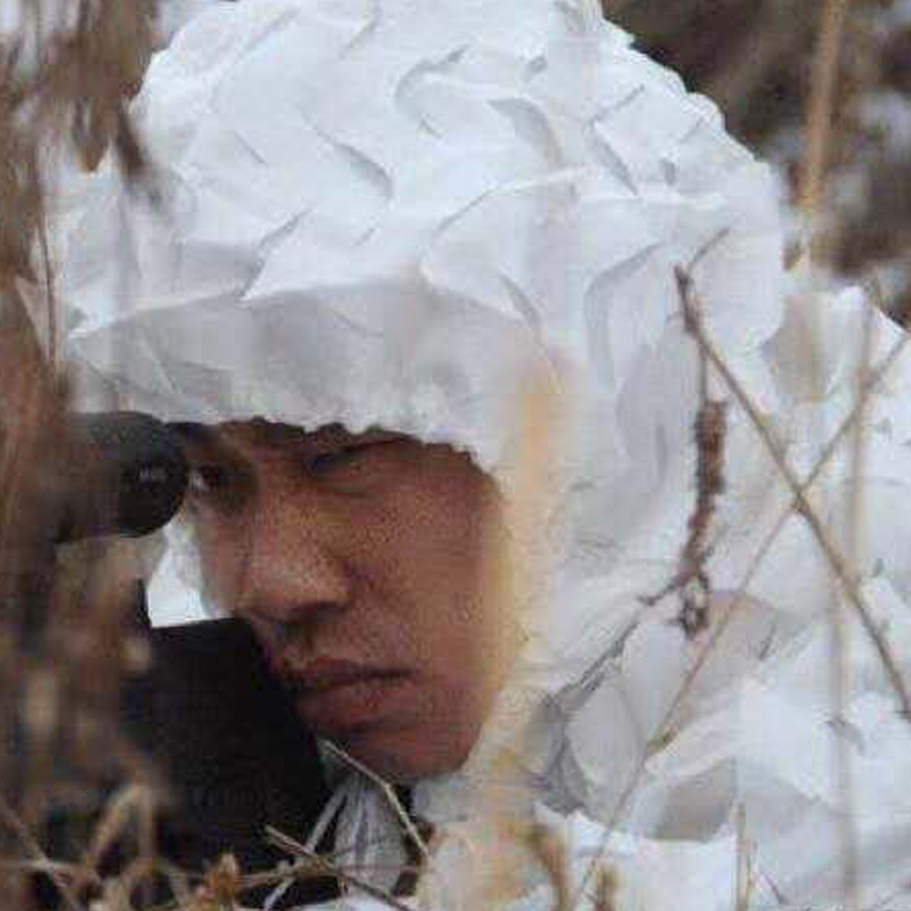 White snow camouflage suit