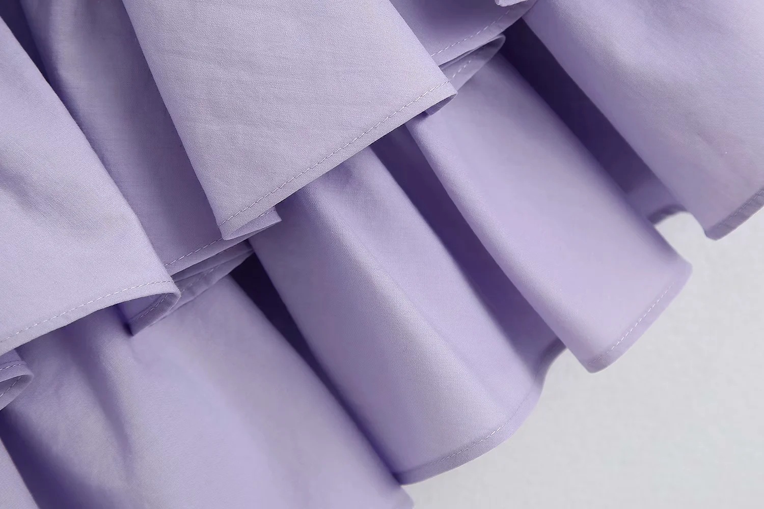 Layered mini skirt with belt