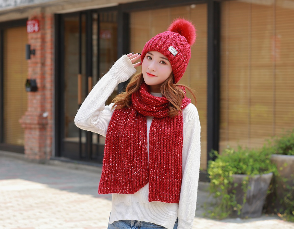 Women knitting wool hat and long scarf