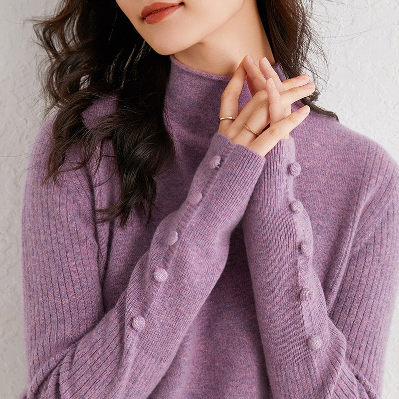 A knitted sweater with a half - high head button