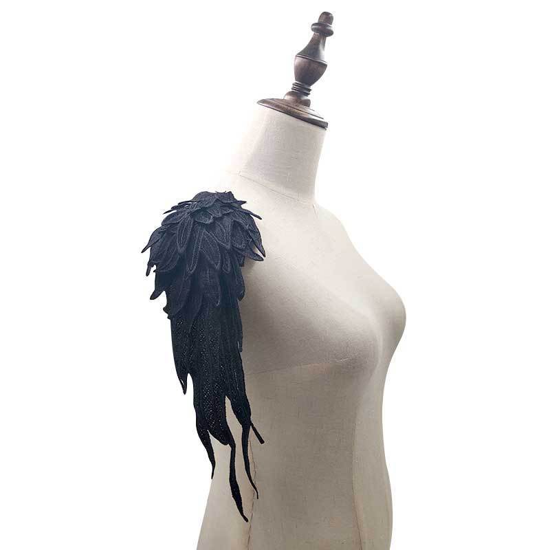 Lace embroidered wings on flowers — image 1