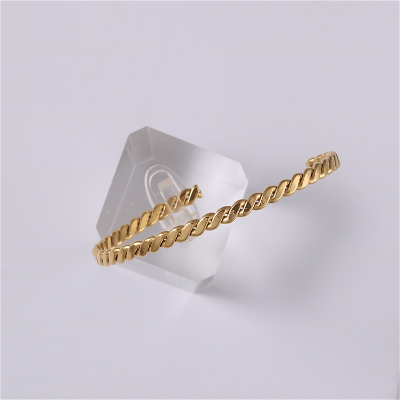 Embossed woven metal bracelet