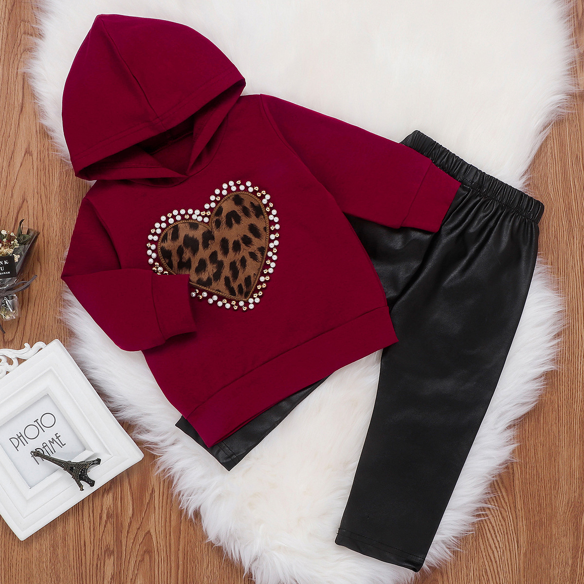 Two-piece hooded sweater and leather pants